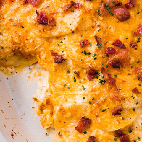 cheesy loaded scalloped potatoes topped with bacon and chives