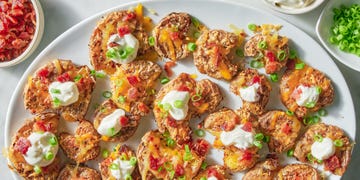 smashed potatoes with cheese, sour cream, bacon and chives