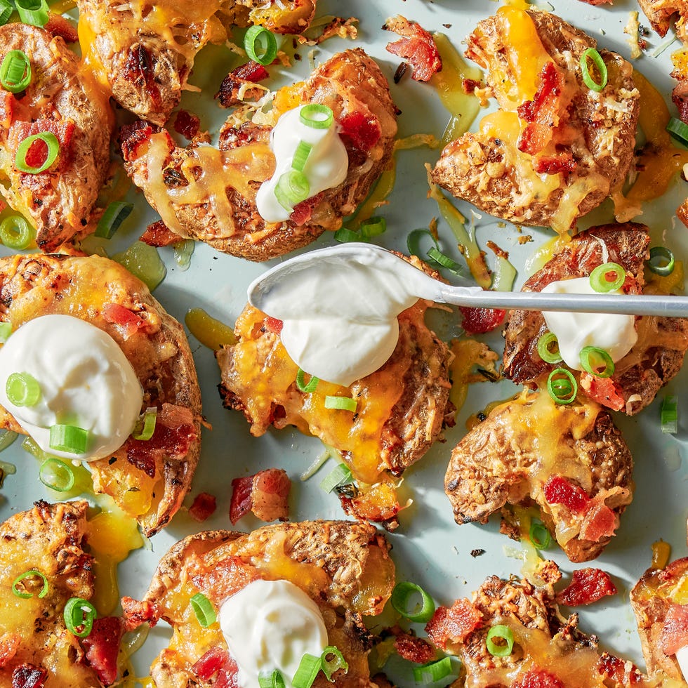 smashed potatoes with cheese, sour cream, bacon and chives