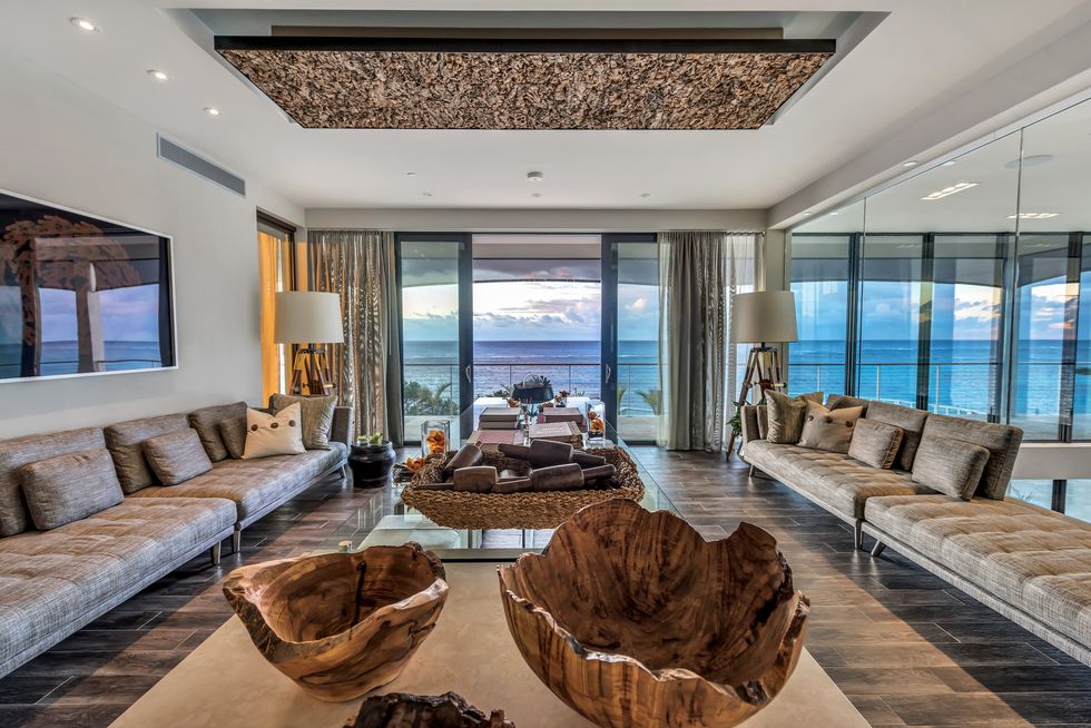 sleek, modern design, accentuates the land’s natural contours,architectural elegance transitions seamlessly into the majestic beauty of the ocean,unprecedented contemporary aesthetic infused with bermudian charmeight acres of magnificent coastal landscape with sweeping ocean vistas from every vantage point
