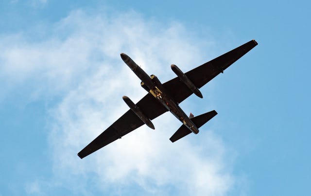 airplane against a blue sky seen from below