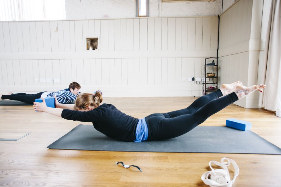 locust position, yoga class, exercise studio