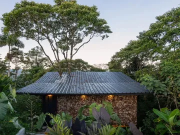 the structure features a metal roof and walls