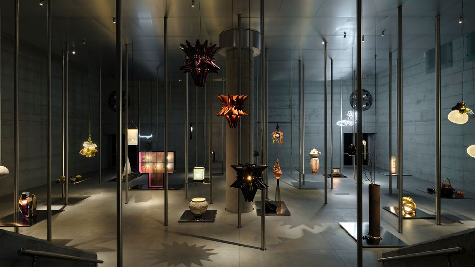 a room with glass walls and a large display of objects