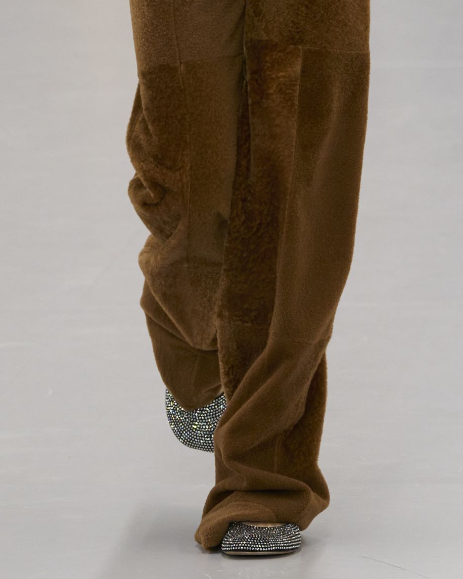 a person wearing brown pants