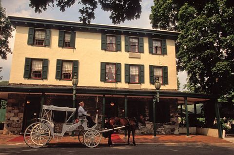 pennsylvania, bucks county, new hope, logan inn, 1727, colonial style architecture, with horse drawn carriage in front photo by jeff greenberguniversal images group via getty images