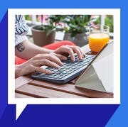 woman typing on logitech keyboard woman typing on logitech keyboard