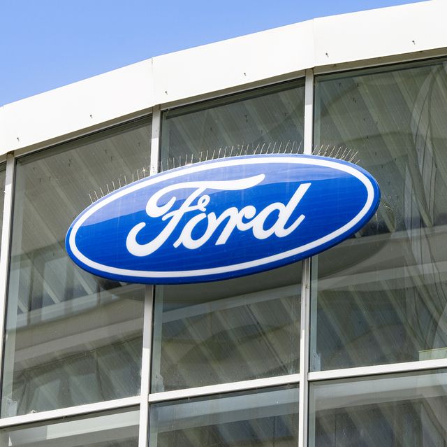 logo of ford at a car dealership