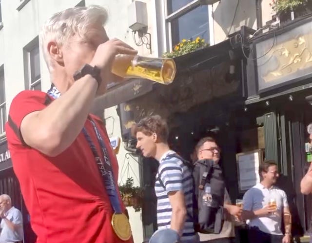 celebration in a street with people socializing and drinking drinks