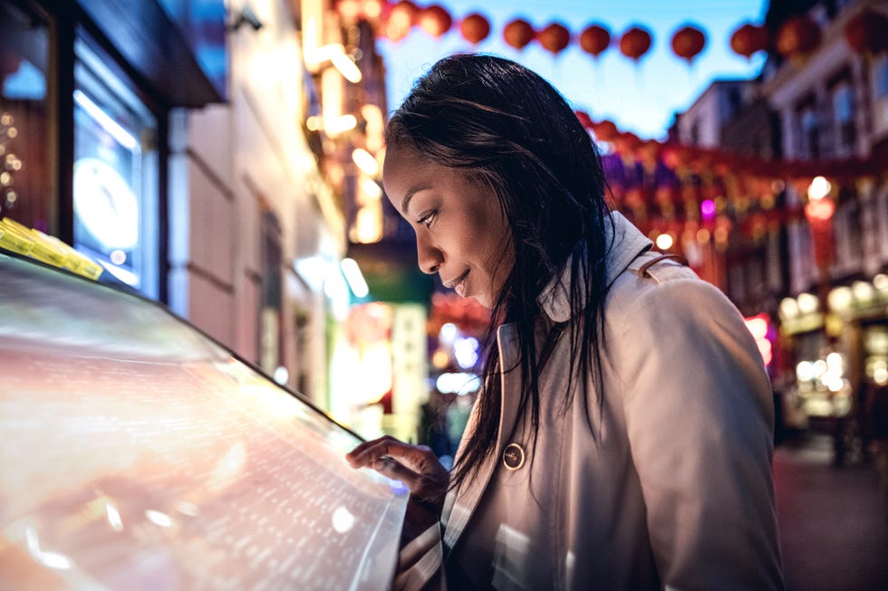 london chinatown, woman walking in the night and meet friends