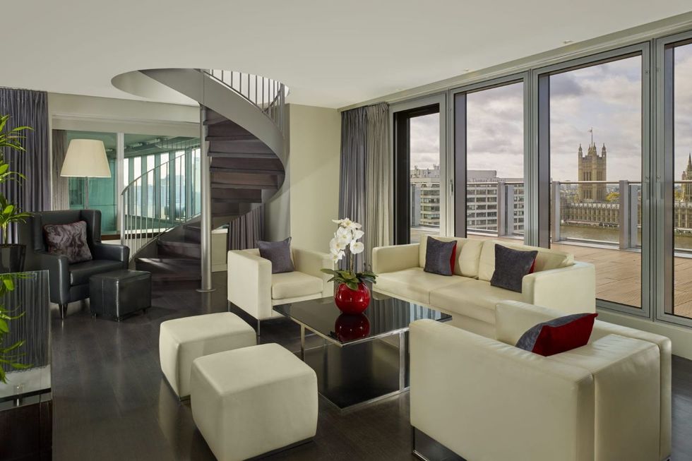 a suite with seating and large window in the park plaza