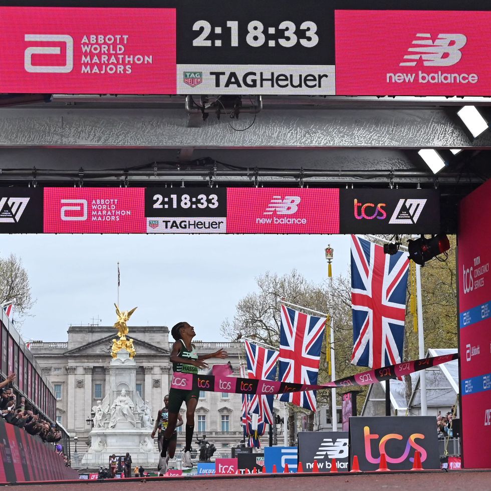 netherlands sifan hassan breaks the tape to win the womens race at the finish of the 2023 london marathon in central london on april 23, 2023