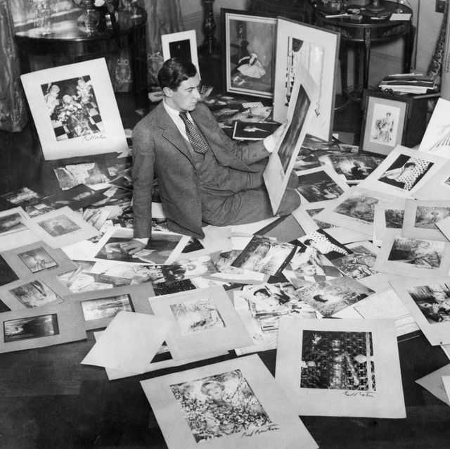 cecil beaton on floor choosing pictures