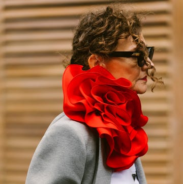 a person with a red rose in the hair a person with a red rose in the hair