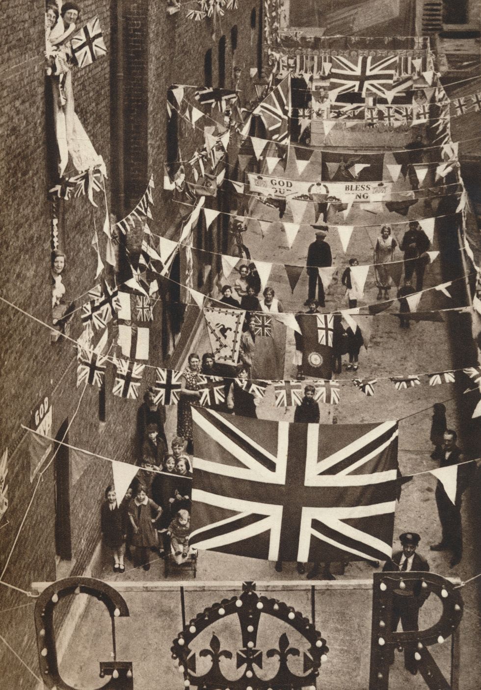 a street in blackfriars, london, decorated for king george vi's coronation in 1937