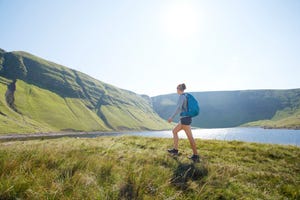 lone female hiking in beautiful nature, brecon beacons