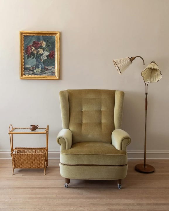 cozy living space featuring a vintage armchair and decorative elements