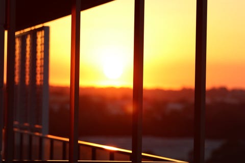 Sunset Seen Through Glass Window Sunset Seen Through Glass Window