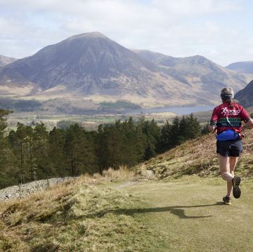 fell runner descends mountain