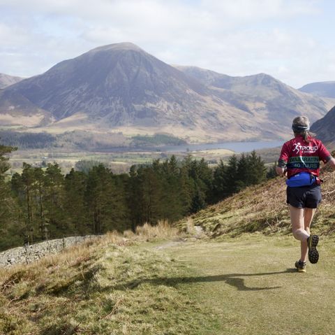 fell runner descends mountain