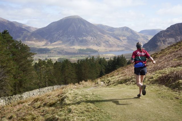 fell runner descends mountain