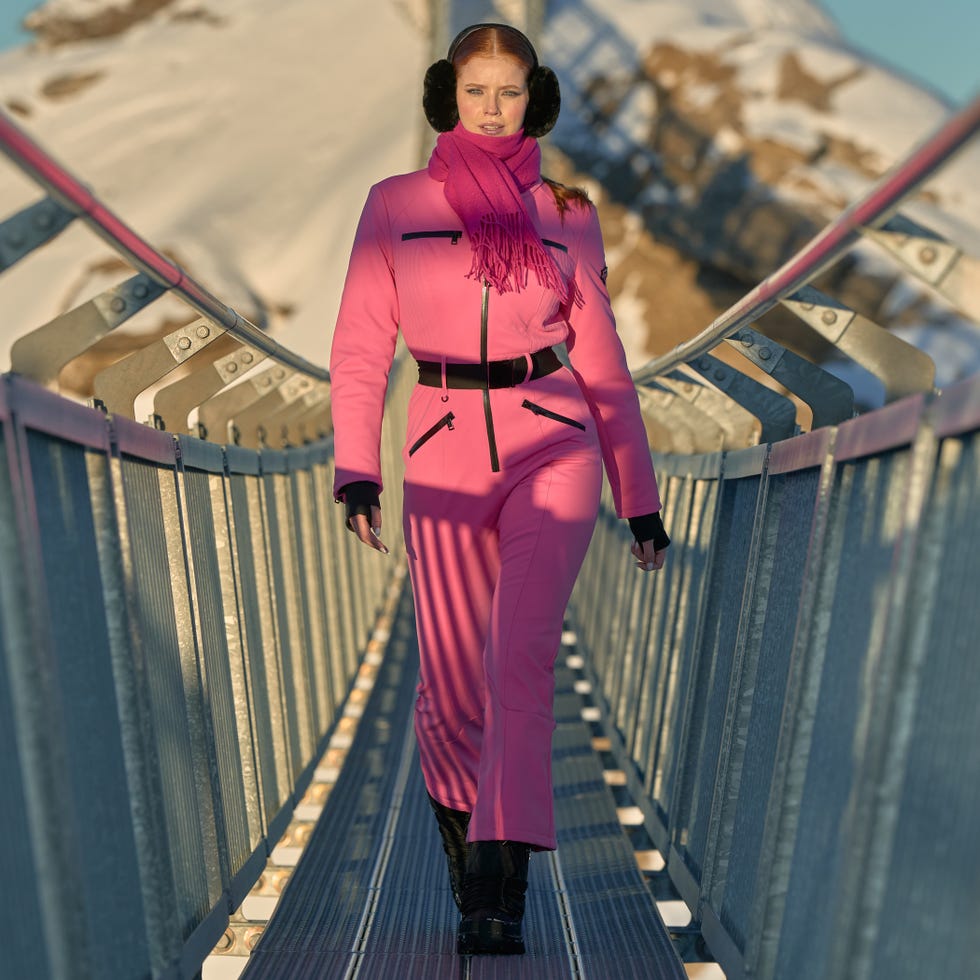 models walk across the Peak Walk in Guess ski collection