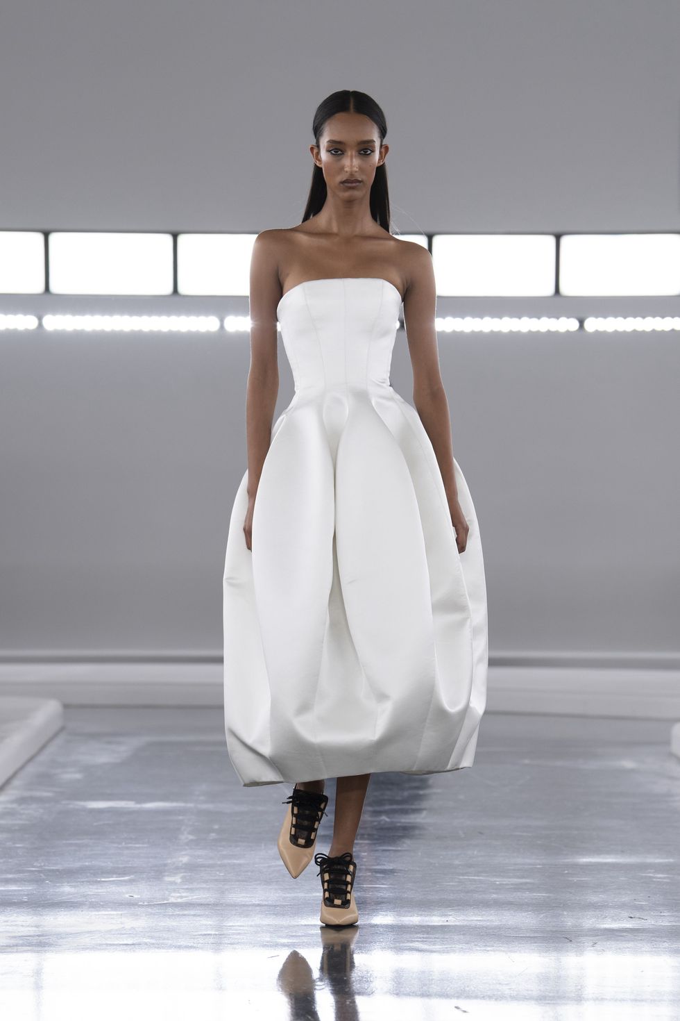 a person wearing a white dress