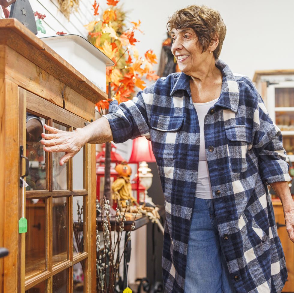 woman browses vintage furniture
