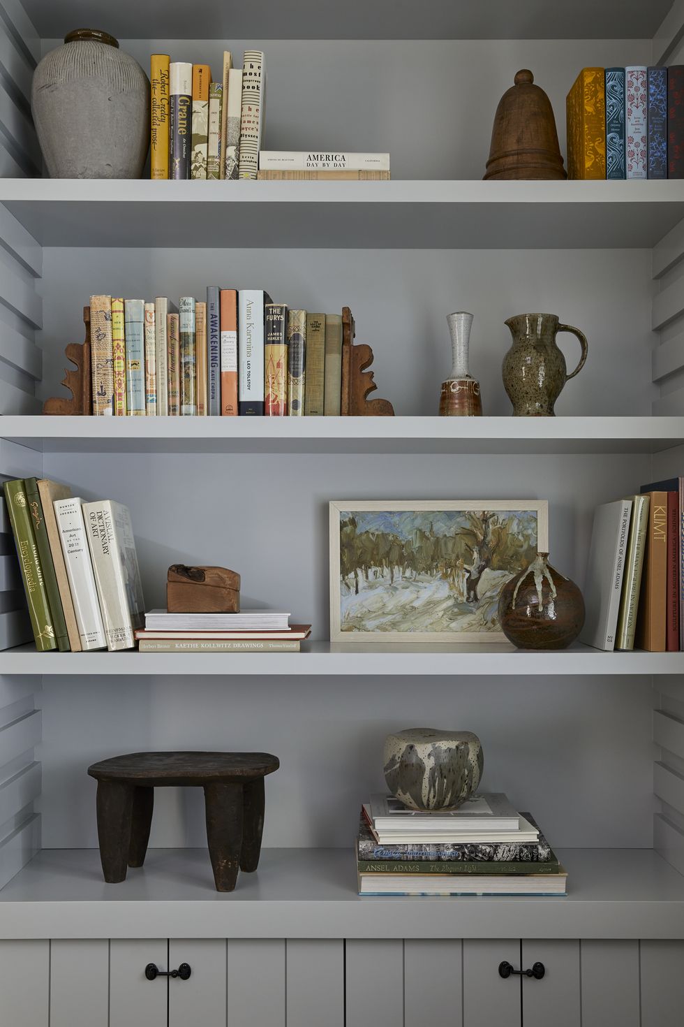 bookshelf with books and other curiosities
