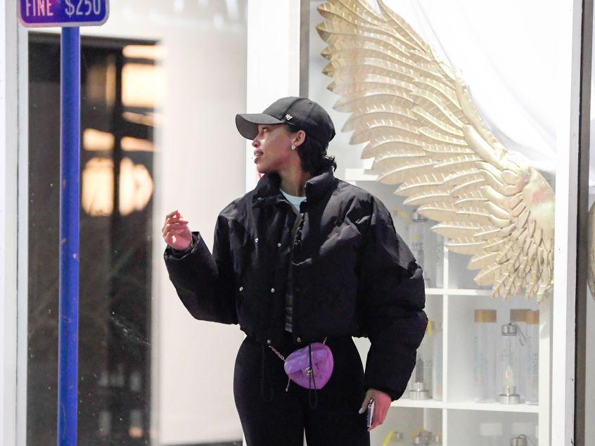 Lori Harvey Runs Errands in Chanel Rainboots and a Cropped Puffer
