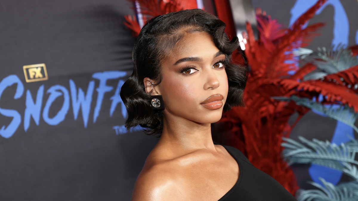 Lori Harvey goes braless under completely see-through red dress