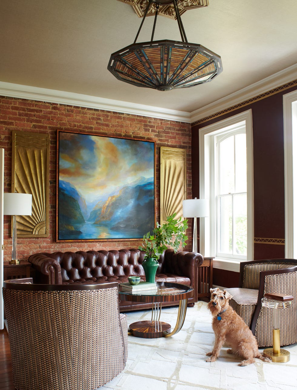 living room with chesterfield sofa and dog