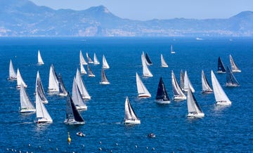 a group of sailboats on the water