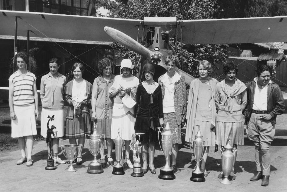 aviatrix amelia earhart and peers posing at special award ceremony