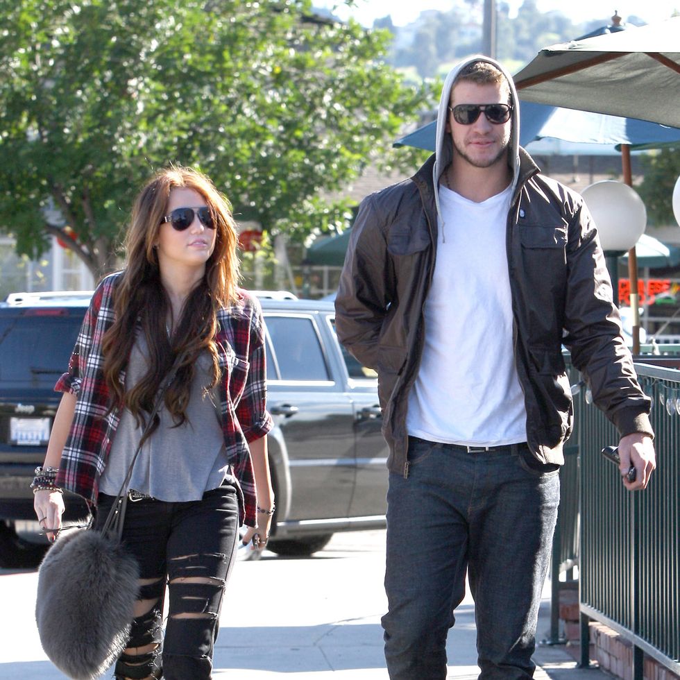 MILEY CYRUS was spotted with her LIAM HEMSWORTH and her dog buying coffee