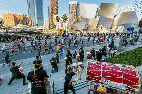 Members of the Venice Koshin Taiko drumming ensemble perform for Los Angeles Marathon runners as they race past the Walt Disney Concert Hall in Los Angeles Sunday, March 18, 2018.