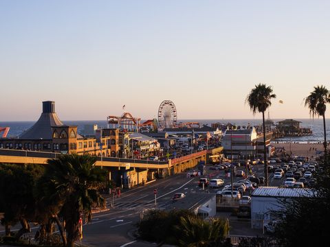 usa, los angeles, santa monica beach pier and pacific park at sunset