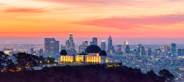 los angeles skyline at dawn panorama and griffith park observatory in the foreground