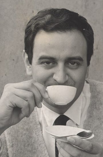 a person eating a cup of coffee