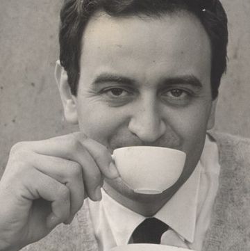 a person eating a cup of coffee