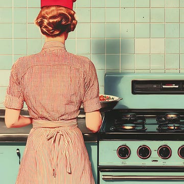 Woman in Retro Dress Cooking on Teal Gas Stove in Vintage Kitchen retro kitchen scene, woman in vintage dress using teal gas stove, mid century modern aesthetic, warm lighting, teal and brown tones, home cooking