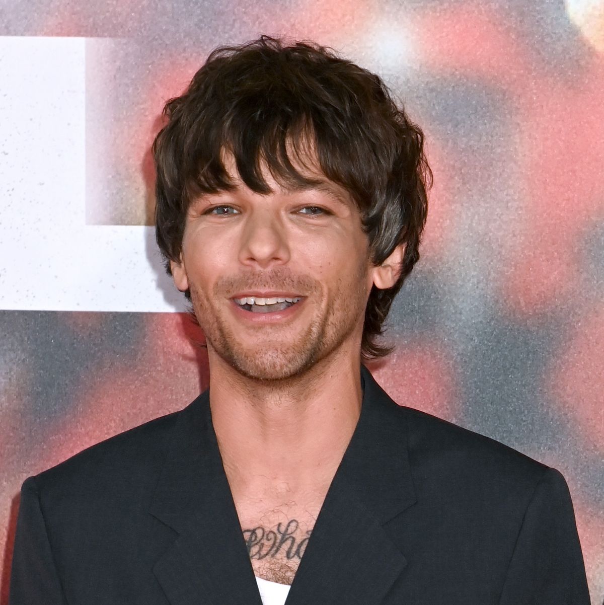 https://hips.hearstapps.com/hmg-prod/images/louis-tomlinson-arrives-at-the-all-of-those-voices-uk-news-photo-1682515799.jpg?crop=0.816xw:0.545xh;0.0750xw,0&resize=1200:*