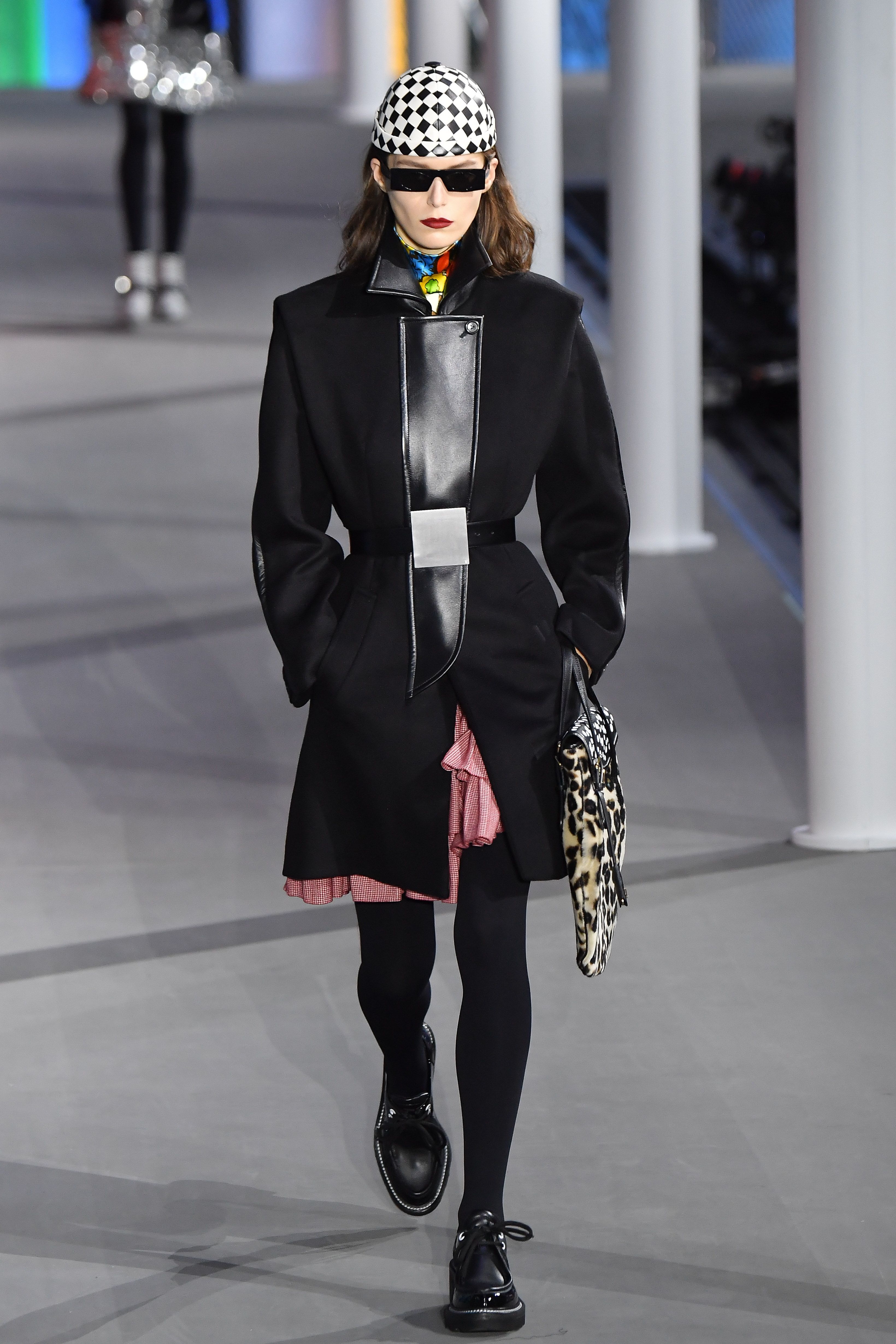 A model displays a creation by designer Nicolas Ghesquiere for Louis  Vuitton Fall-Winter 2014/2015 Ready-To-Wear collection show held at Cour  Carree du Louvre in Paris, France, on March 05, 2014. Photo by