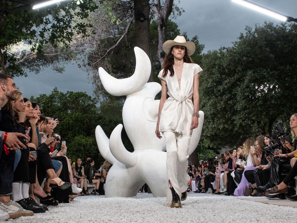 Louis Vuitton fires, then hires shaman to prevent rain at fashion show