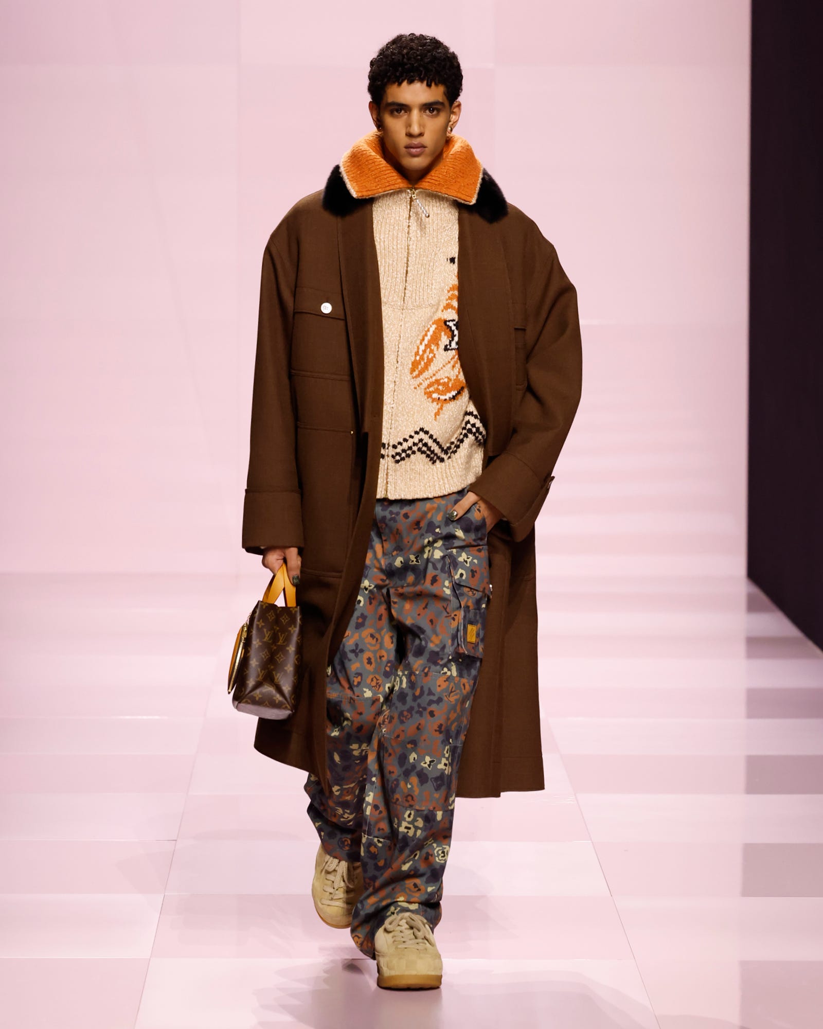 male model on runway showcasing a winter outfit