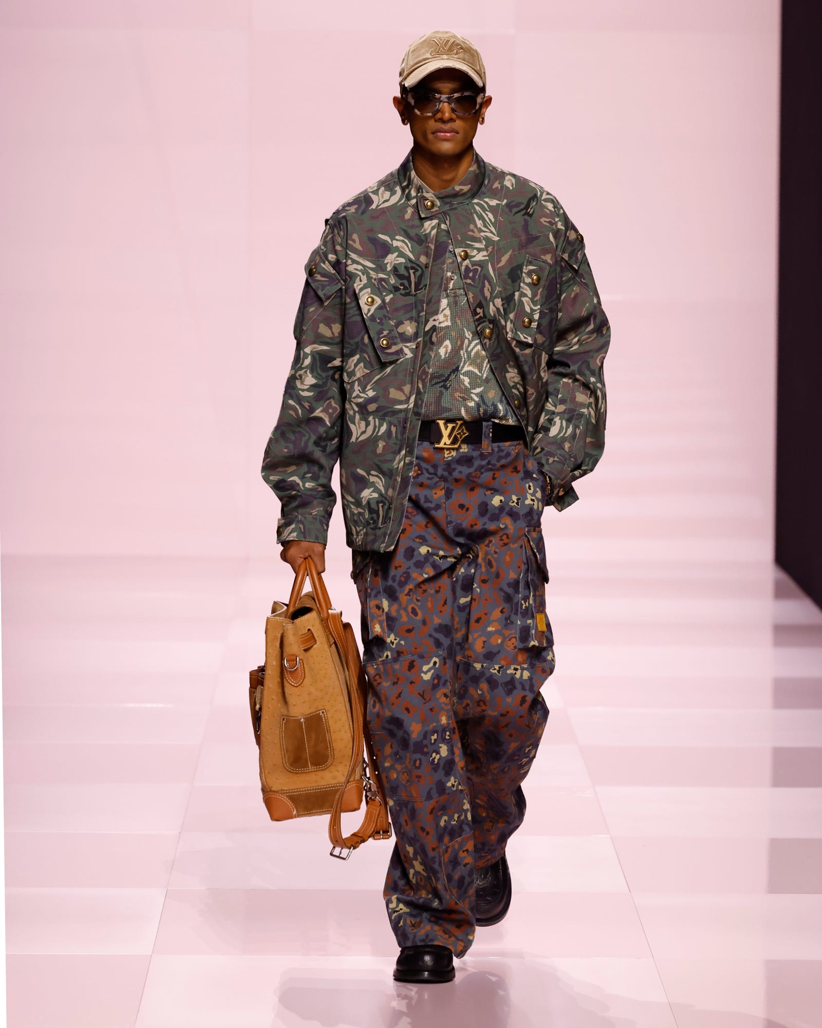 fashion model showcasing urban militaryinspired outfit with bag