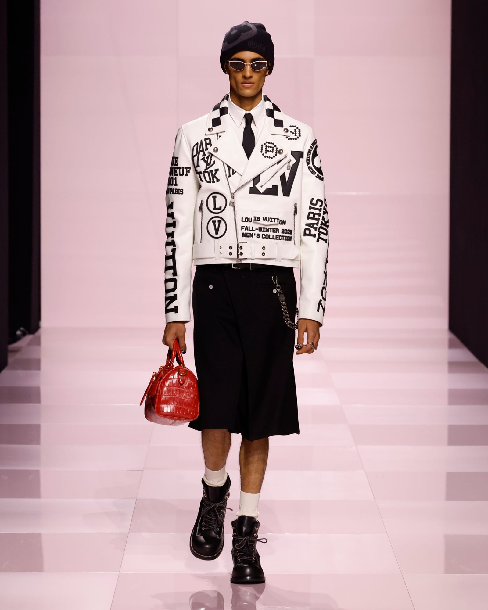 a model showcasing a highfashion outfit during a runway show