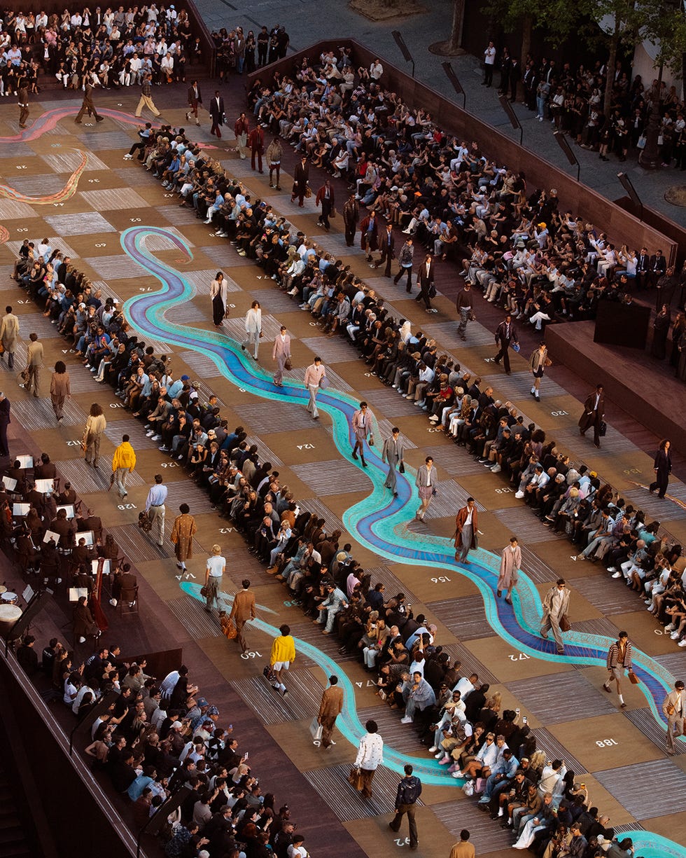 fashion runway featuring models and an audience