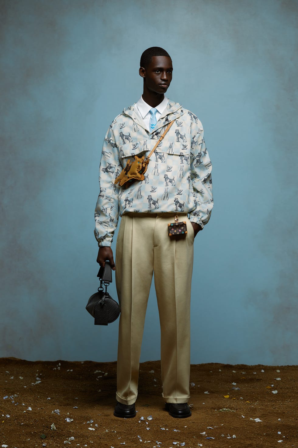a man in a suit holding a purse