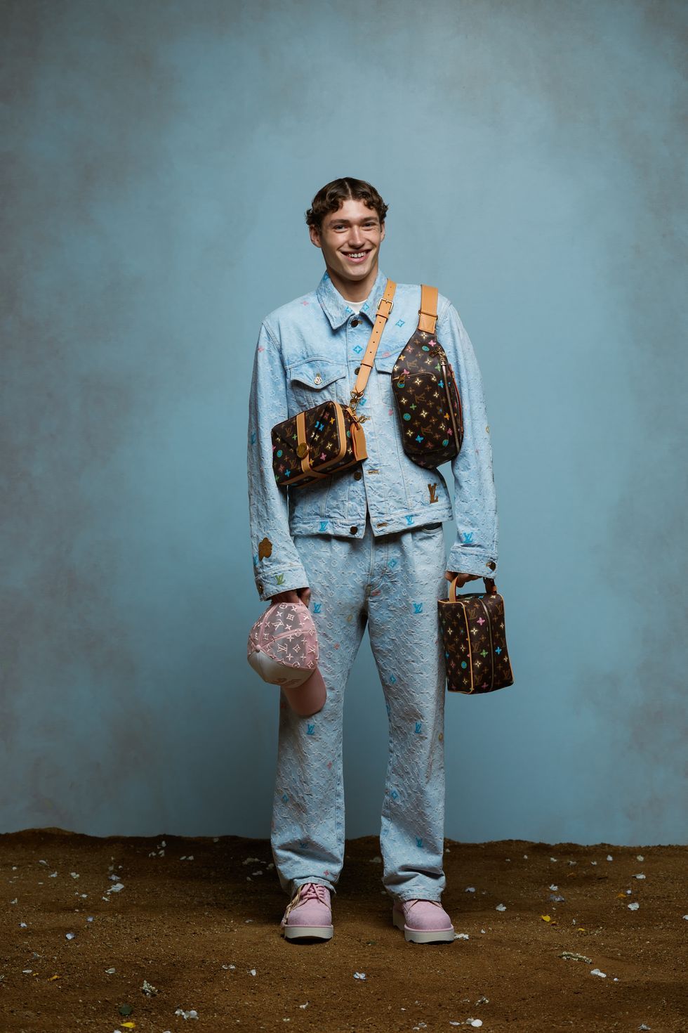 a man smiling with a purse